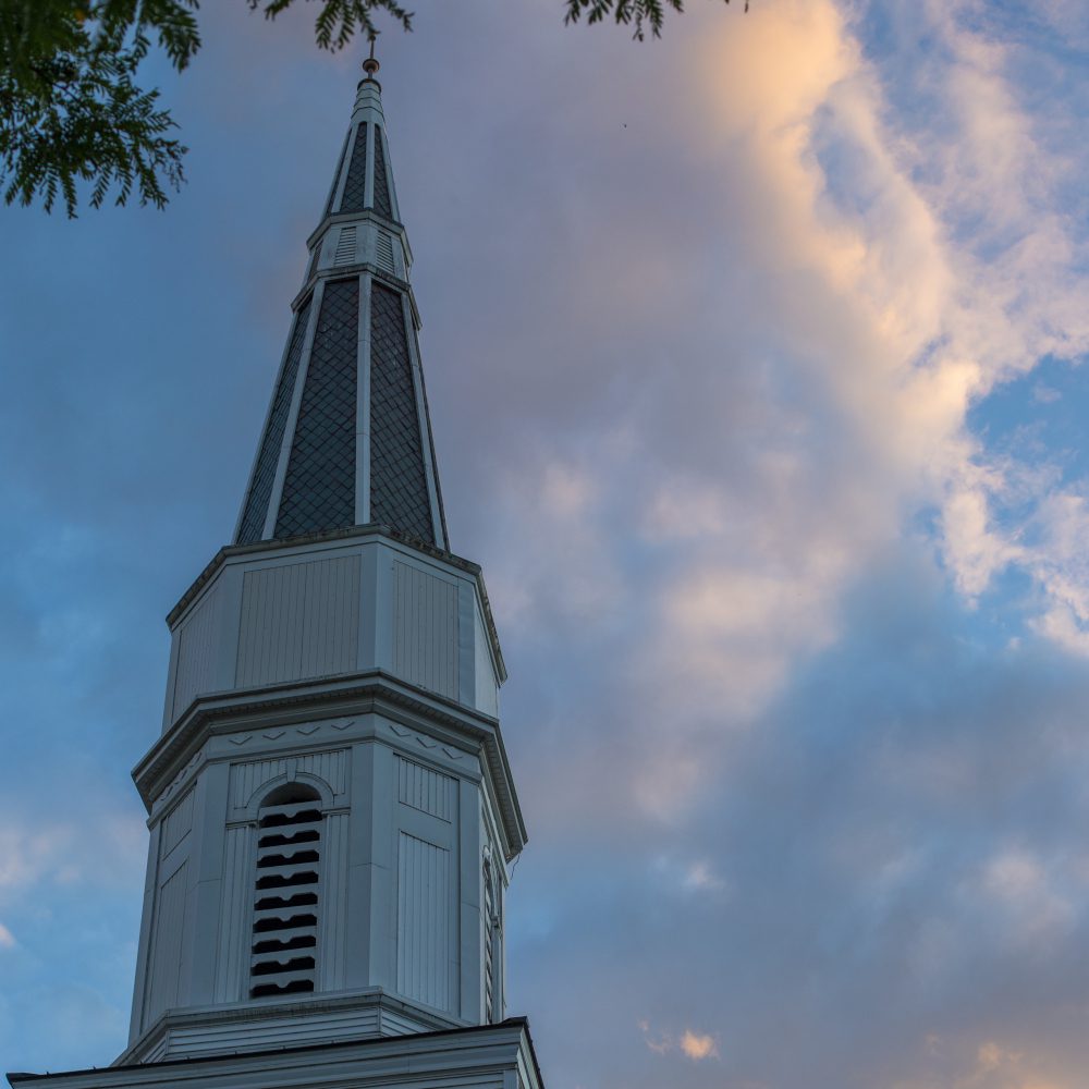 church steeple with clouds in the background