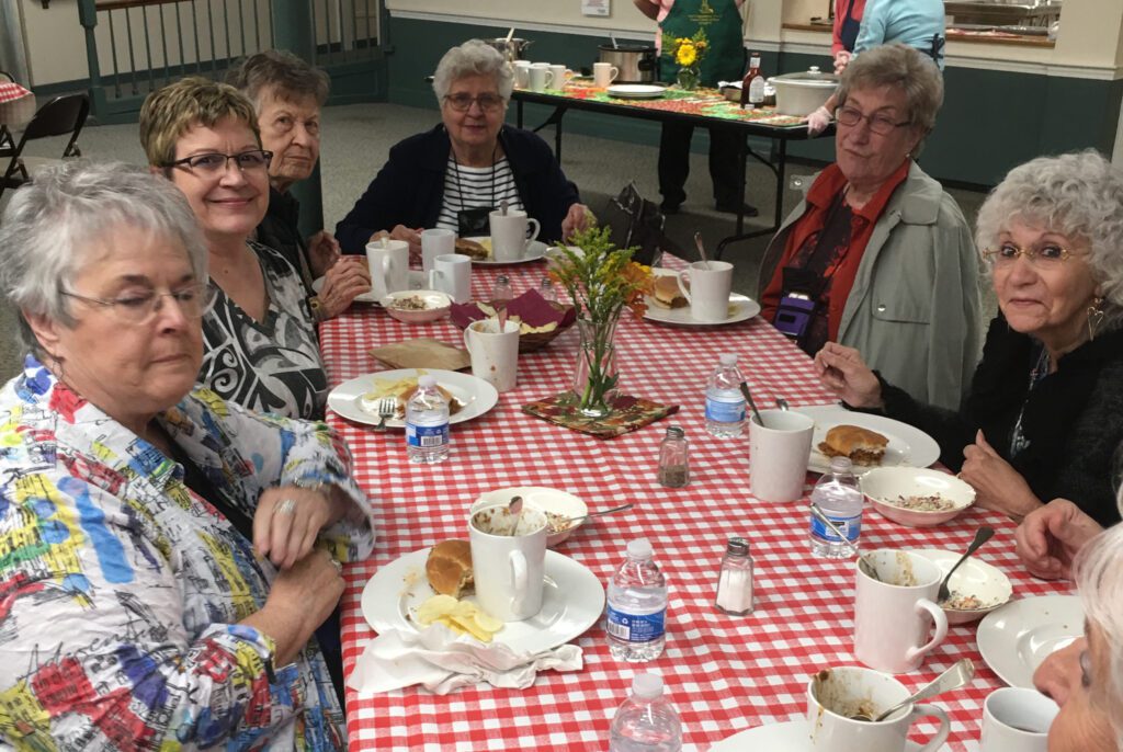 Community members enjoying dinner together